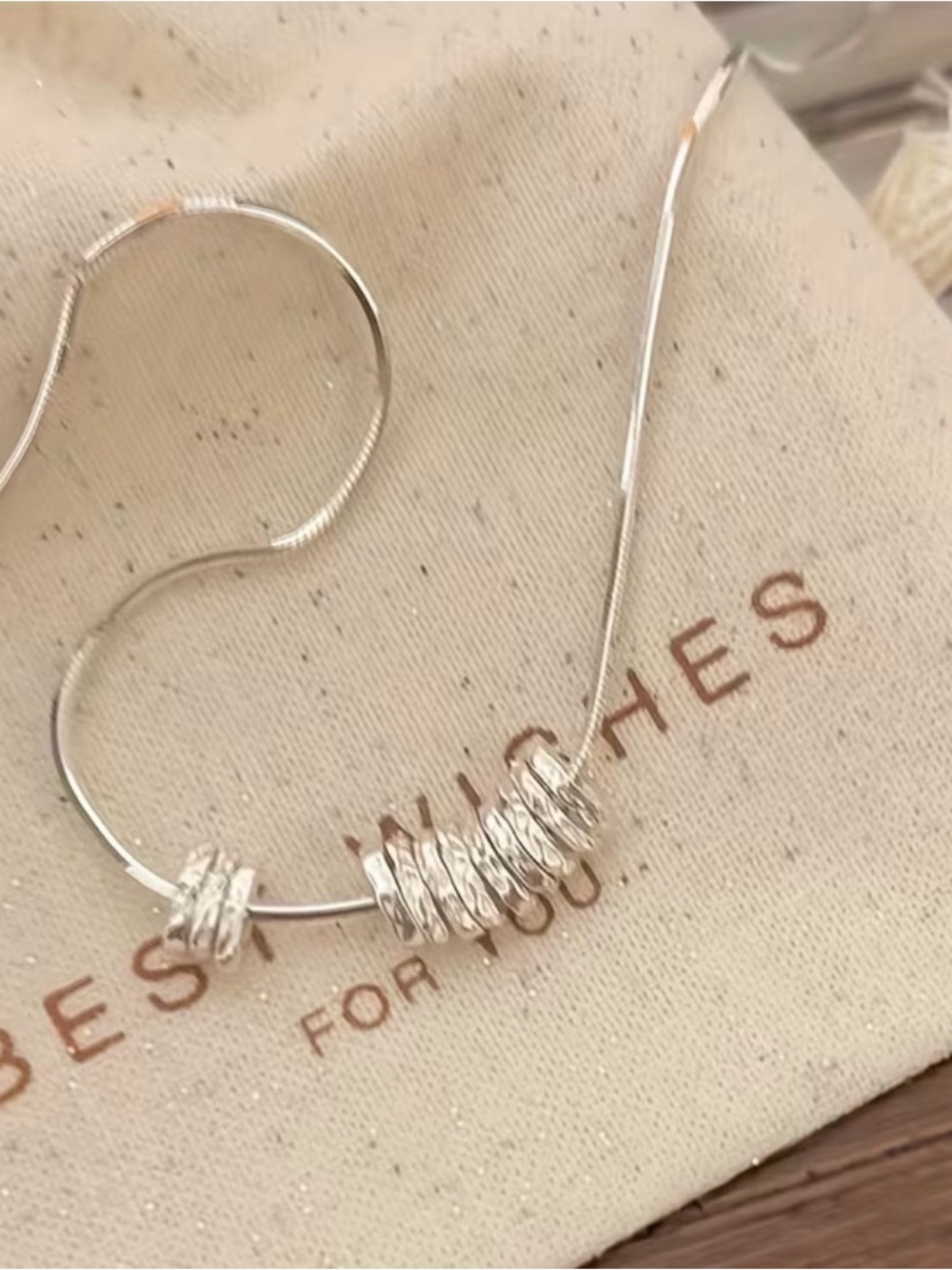 Minimalist Silver Hoop Necklace with Textured Bead Accents
